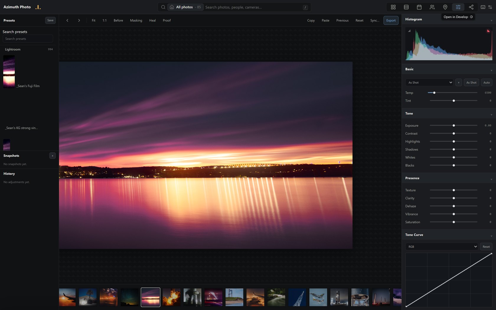 The develop editor on a long-exposure sunset over water, with a live RGB histogram and a preset rail